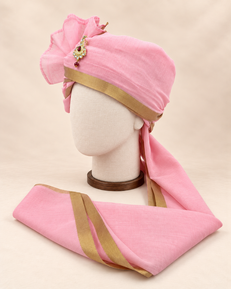 Left side view of baby pink gold border premium barati safa showing the smooth wrap and long bordered tail