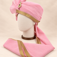Left side view of baby pink gold border premium barati safa showing the smooth wrap and long bordered tail