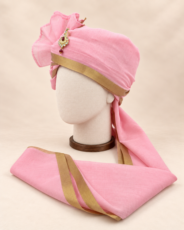 Left side view of baby pink gold border premium barati safa showing the smooth wrap and long bordered tail