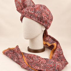Left side view of blush pink paisley Barati Safa showing the smooth wrap and mustard-edged tail