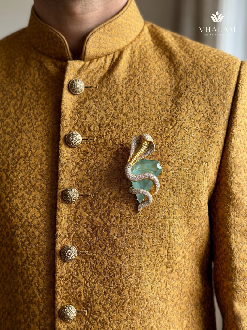 Gold-Tone Cobra Brooch with Pastel Green Accent, styled view