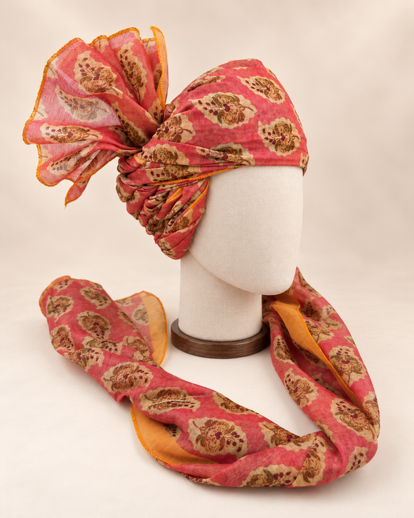 Right side view of coral pink floral medallion Barati Safa showing twisted folds and fan