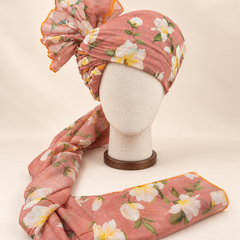 Front view of dusty peach white floral print barati safa showing the patterned wrap and fan