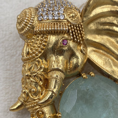 Gold-Tone Elephant Head Brooch with Pastel Green Accent, detail view