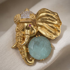 Gold-Tone Elephant Head Brooch with Pastel Green Accent, front view