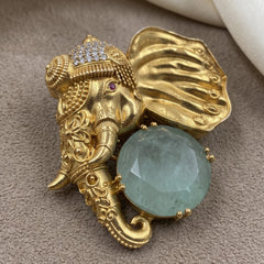 Gold-Tone Elephant Head Brooch with Pastel Green Accent, front view