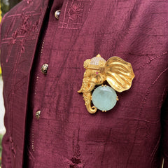 Gold-Tone Elephant Head Brooch with Pastel Green Accent, styled view