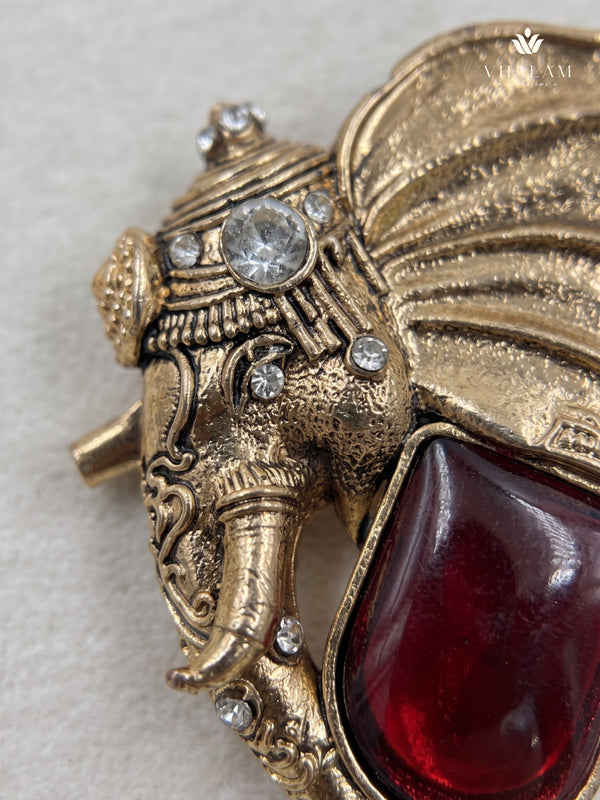 Gold-Tone Elephant Head Brooch with Red Accent, detail view