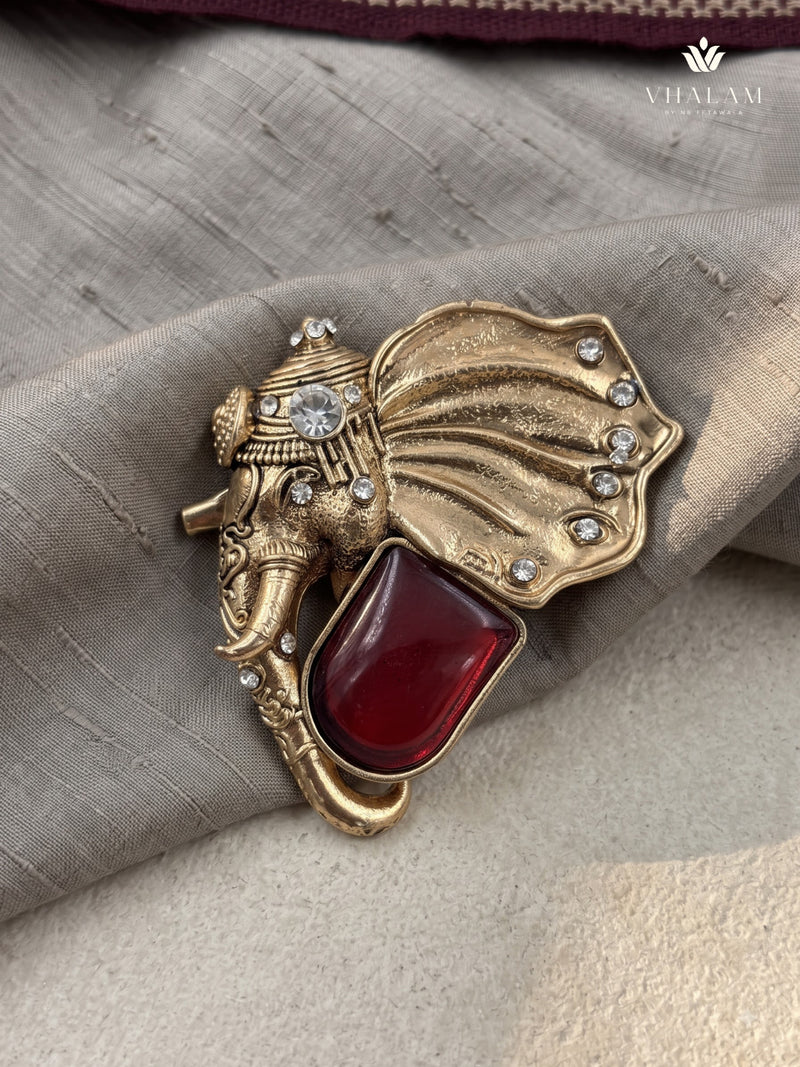 Gold-Tone Elephant Head Brooch with Red Accent, front view