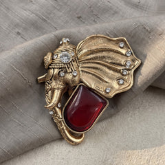 Gold-Tone Elephant Head Brooch with Red Accent, front view