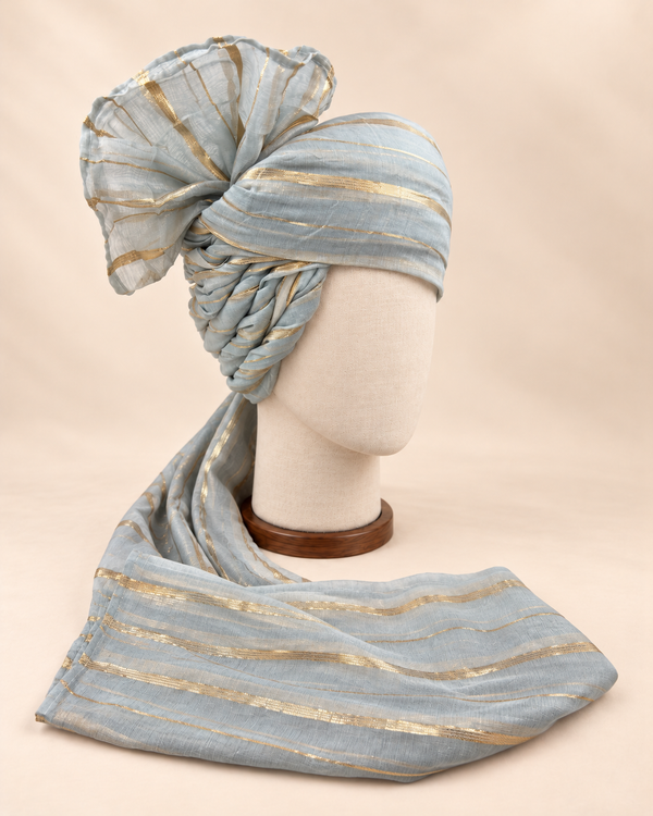 Right side view of grey gold stripe premium barati safa showing the twisted striped folds and fan detail