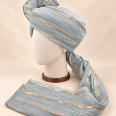 Left side view of grey gold stripe premium barati safa showing the striped wrap and long tail