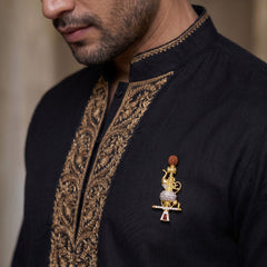 Gold-Tone Gada Motif Brooch with Red Accent, styled view
