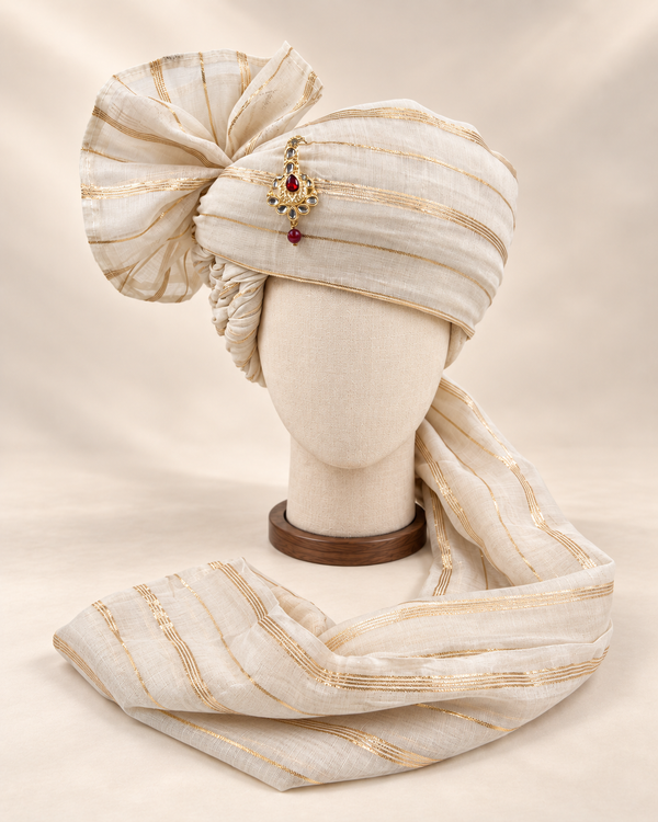 Front view of ivory fine gold stripe premium barati safa showing the gold-tone stripes and angular fan