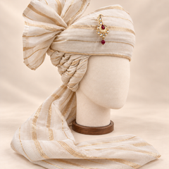 Right side view of ivory fine gold stripe premium barati safa showing the stacked twisted folds and striped fan