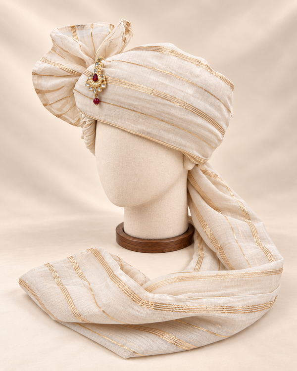 Left side view of ivory fine gold stripe premium barati safa showing the striped wrap and long tail