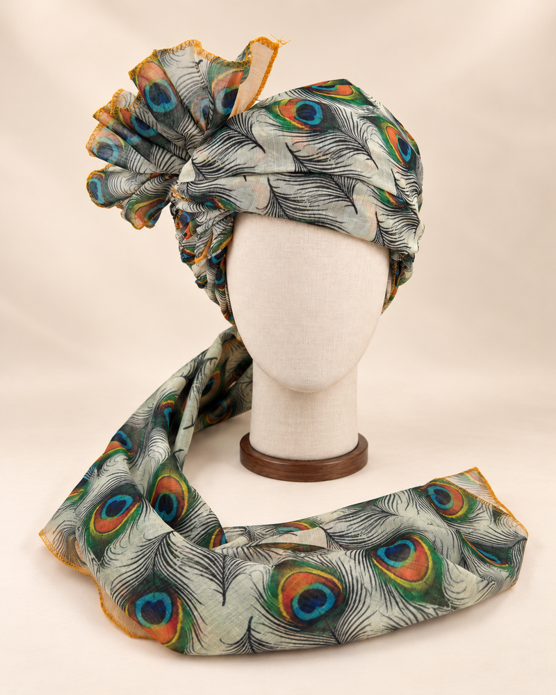 Front view of ivory peacock feather print Barati Safa with black linework and multicolour peacock eyes