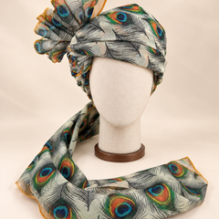 Front view of ivory peacock feather print Barati Safa with black linework and multicolour peacock eyes
