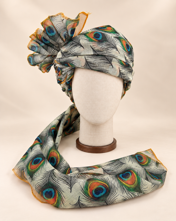 Front view of ivory peacock feather print Barati Safa with black linework and multicolour peacock eyes