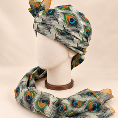 Left side view of ivory peacock feather print Barati Safa showing its wrap and patterned tail