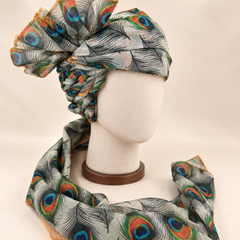 Right side view of ivory peacock feather print Barati Safa showing twisted folds and fan