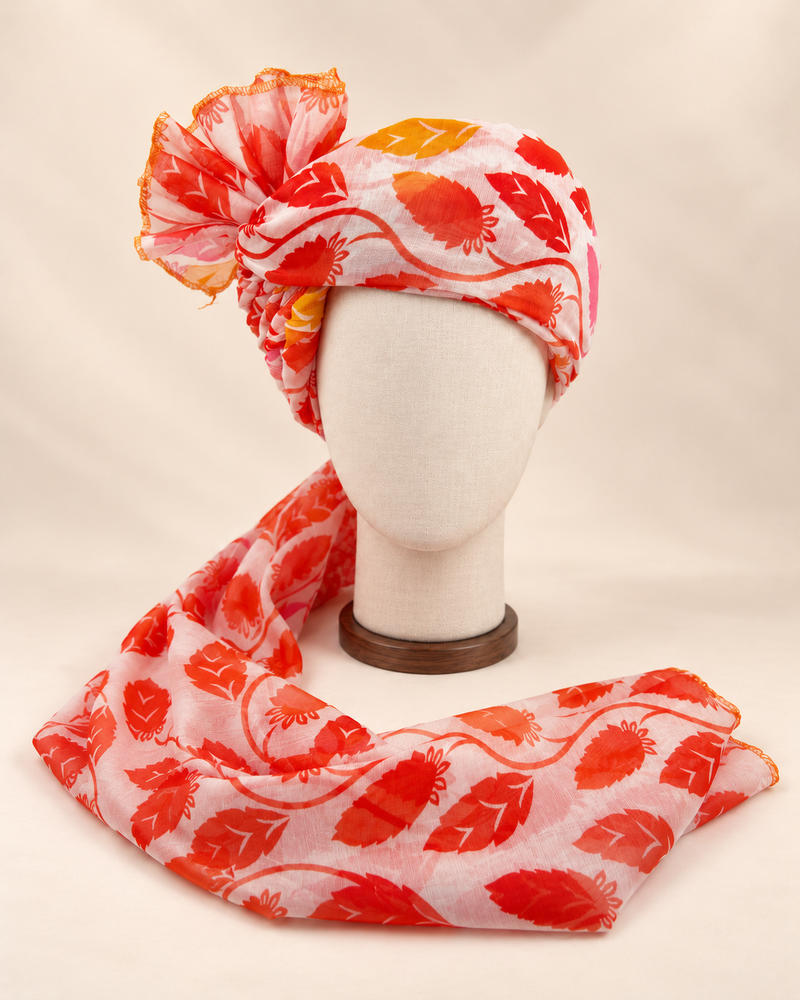 Front view of ivory red leaf print barati safa showing the patterned wrap and fan