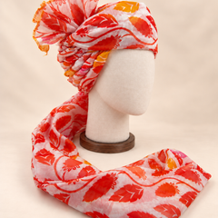 Right side view of ivory red leaf print barati safa showing twisted folds and fan detail