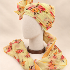 Left side view of lemon yellow floral Barati Safa showing its wrap and floral tail