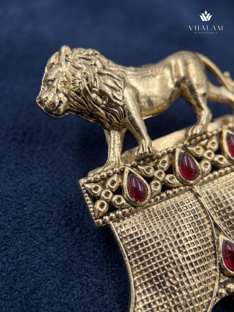 Gold-Tone Lion Crest Brooch with Red Accents, detail view