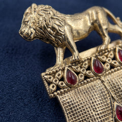 Gold-Tone Lion Crest Brooch with Red Accents, detail view