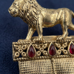 Gold-Tone Lion Crest Brooch with Red Accents, detail view