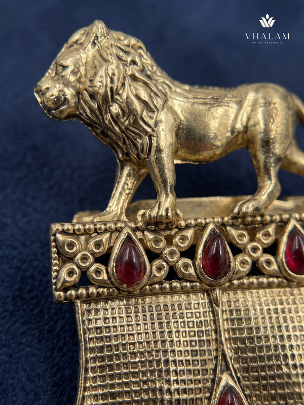 Gold-Tone Lion Crest Brooch with Red Accents, detail view