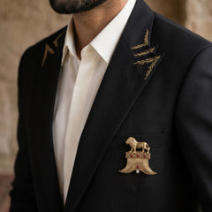 Gold-Tone Lion Crest Brooch with Red Accents, styled view