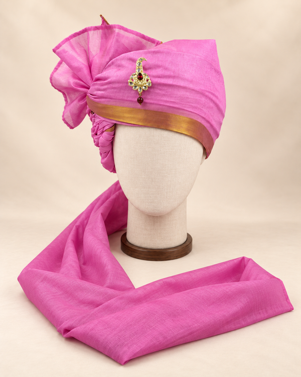 Front view of magenta gold border premium barati safa showing the gold-tone border and broad fan