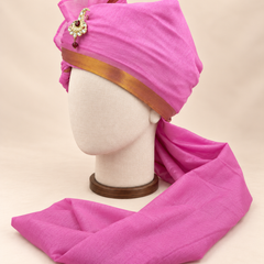 Left side view of magenta gold border premium barati safa showing the smooth wrap and long bordered tail