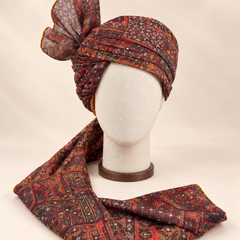 Front view of maroon and charcoal geometric Barati Safa with ochre accents and patterned tail