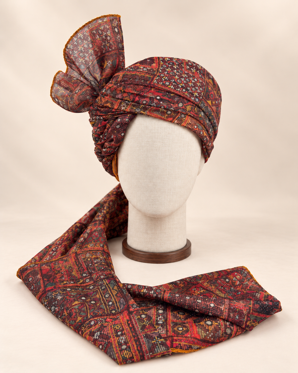 Front view of maroon and charcoal geometric Barati Safa with ochre accents and patterned tail