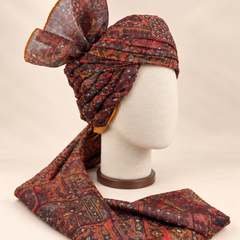 Right side view of maroon and charcoal geometric Barati Safa showing twisted folds and fan