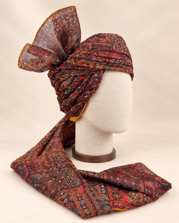 Right side view of maroon and charcoal geometric Barati Safa showing twisted folds and fan