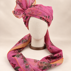 Front view of mauve rose floral print barati safa showing the patterned wrap and fan