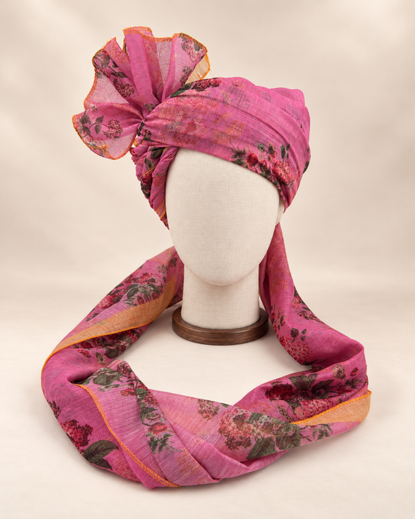 Front view of mauve rose floral print barati safa showing the patterned wrap and fan