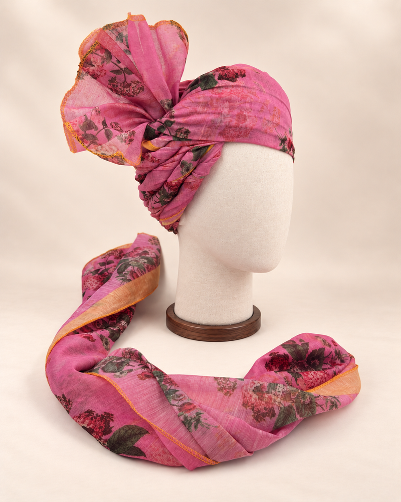 Right side view of mauve rose floral print barati safa showing twisted folds and fan detail