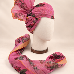 Right side view of mauve rose floral print barati safa showing twisted folds and fan detail