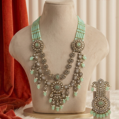 Mint Bead Rosette Moissanite Dulha Mala on a cream display bust