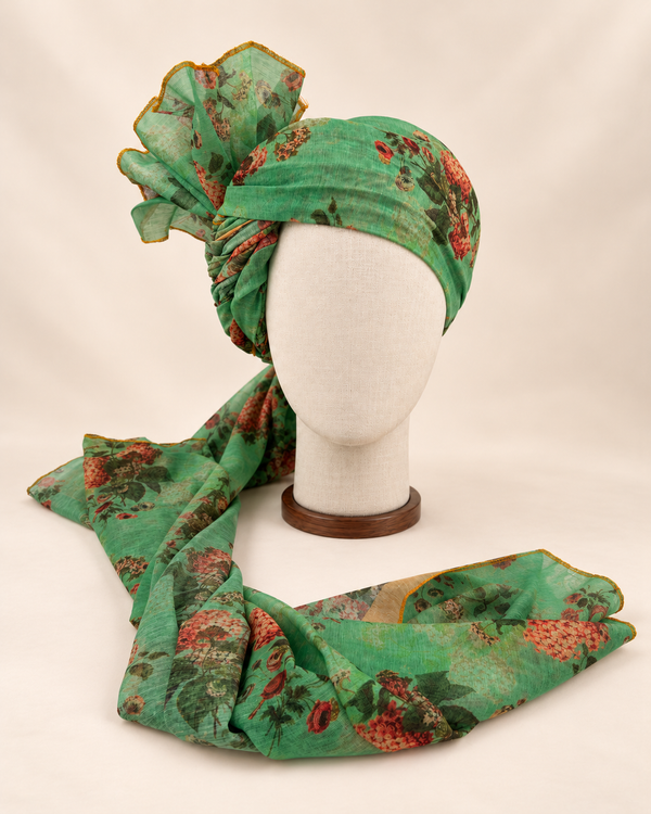 Front view of mint green rose floral print barati safa showing the patterned wrap and fan