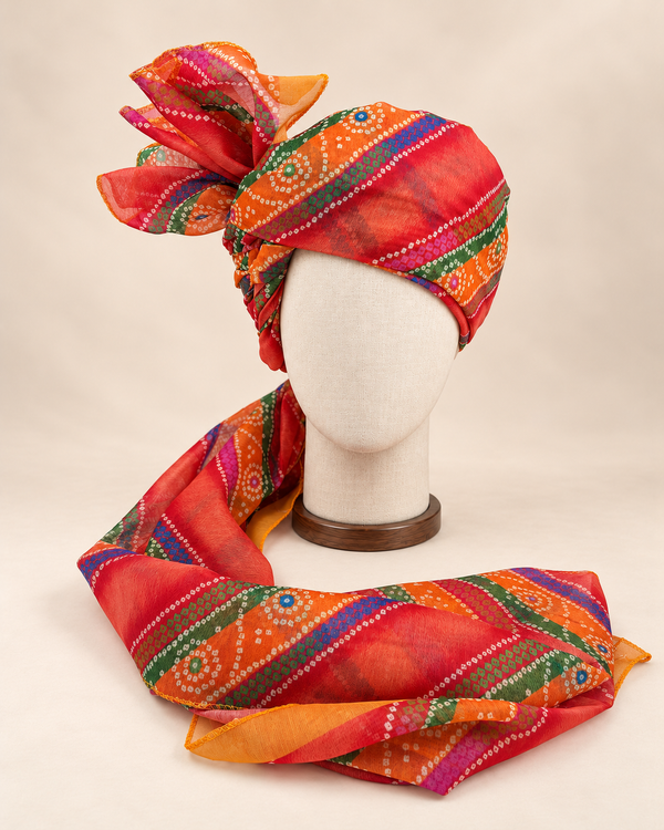 Front view of multicolour banded bandhani print barati safa showing the patterned wrap and fan