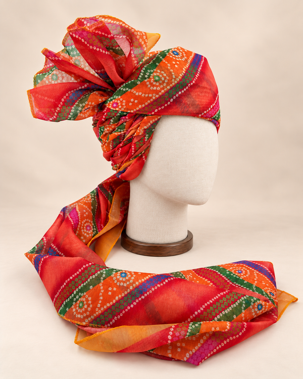 Right side view of multicolour banded bandhani print barati safa showing twisted folds and fan detail