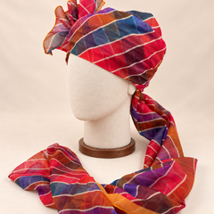 Left side view of multicolour leheriya stripe barati safa showing the smooth wrap and long patterned tail