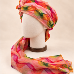 Left side view of multicolour wave print barati safa showing the smooth wrap and long patterned tail