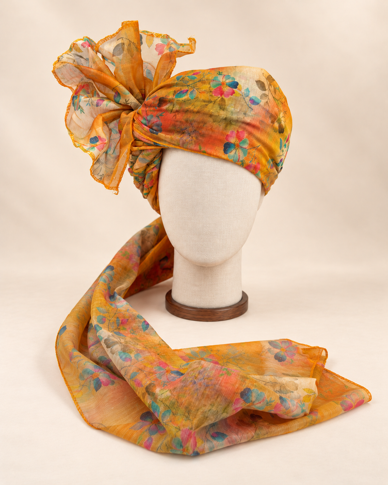 Front view of mustard multicolour floral print barati safa showing the patterned wrap and fan